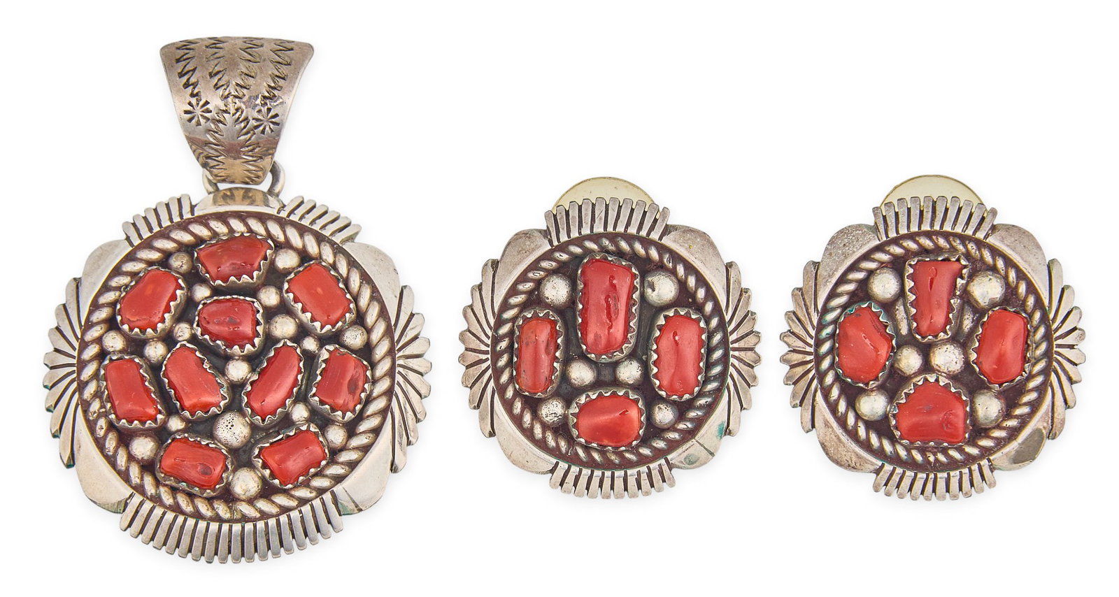 Sterling Silver & Coral Jewelry Set: Sterling silver pendant set with coral cabochons and stamped details, and matching pair of earrings, each marked "Sterling K" Size: 2 in. x 1.5 in. / pendant with bail Total weight: 38.3 g P