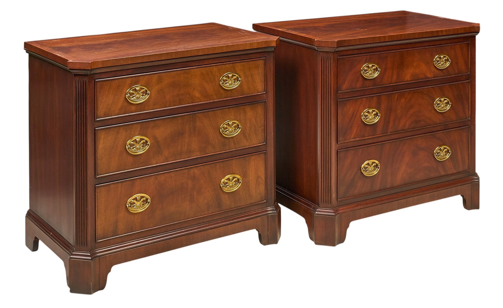 Pair of Three-Drawer Chests: Pair of wooden chests, each with three drawers with decorative brass pulls height 29 in. x width 33 in. x depth 19.5 in. / each Provenance: Property from a home in San Antonio, Texas