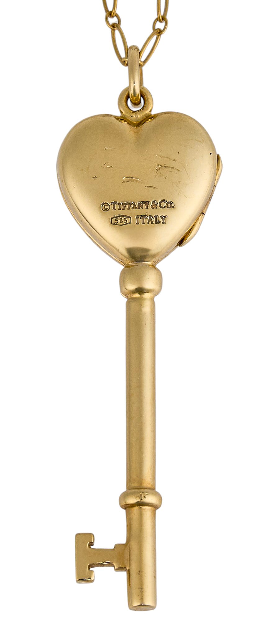 Tiffany & Co. 14K Key Locket Pendant with Chain: Tiffany & Co. 14K yellow gold key pendant necklace, pendant featuring locket to key's handle, marked "Tiffany & Co. 585 Italy", on a 14K yellow gold chain Length: 16 in. Total