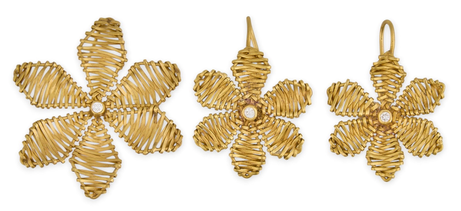 14K Flower Pendant & Earrings: 14K gold (tested) wire-work set to include pair of dangle earrings and pendant in flower motif, each set with single round diamond detail Size: 1 3/8 in. / diameter Total weight: 7.5 g Provenance: