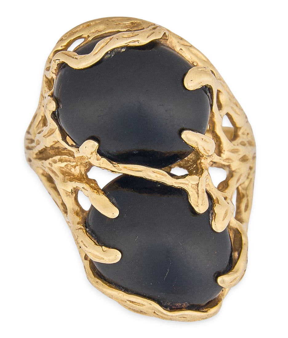 14K Onyx Ring: 14K gold ring set with two oval-cut onyx cabochons, in textured framework setting, marked "14K" Size: 5 Total weight: 5.3 g Provenance: Property from a home in Boerne, Texas