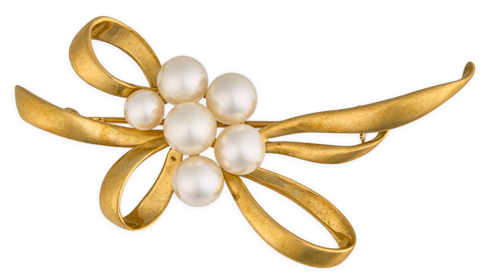 18K Pearl Bow Brooch: 18K gold brooch set with six round pearls, ranging approximately 4.8-6.4 mm, bow motif metal framework, marked "K18" Size: 2.25 in. Total weight: 8.5 g Provenance: Property