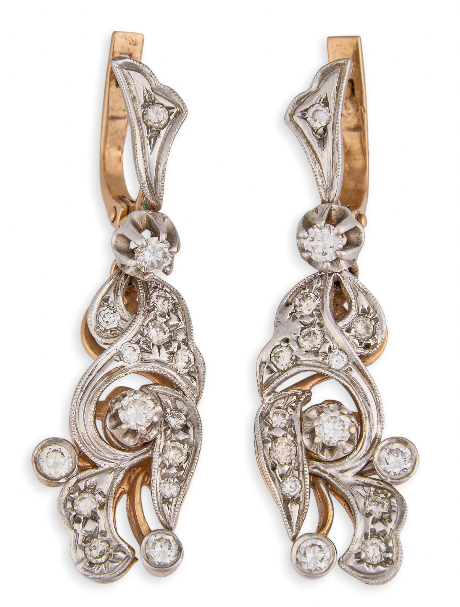 14K Two-Tone Diamond Earrings: 14K two-tone gold dangle earrings set with round brilliant cut diamonds, marked "14K" Length: 1.5 in. Total weight: 11.2 g Provenance: Property from a home in San Antonio, Texas