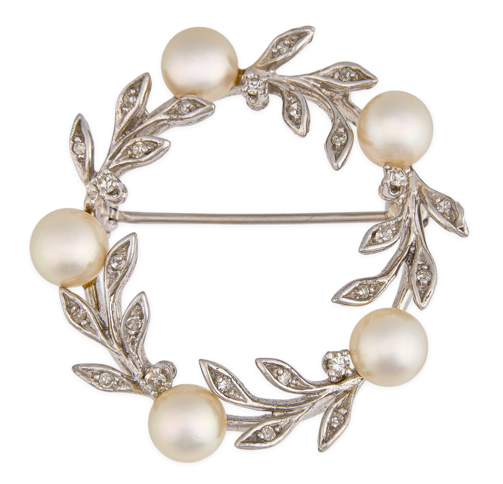 14K Diamond & Pearl Brooch: 14K white gold brooch set with five round pearls, accented by round-cut diamonds in foliate settings Size: 1.25 in. / diameter Total weight: 6.92 g Provenance: Property from a home in the Alamo