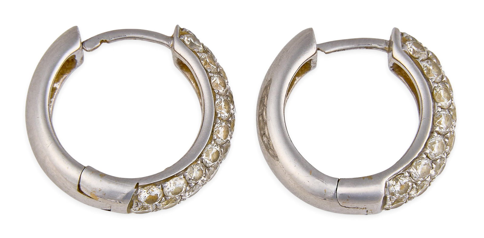 18K Diamond Hoop Earrings: Pair of 18K white gold hoop earrings, set with round pave-set diamonds, marked "18K 750" Size: 0.66 in. / diameter Total weight: 5.95 g Provenance: Property from a home in the Alamo Heights