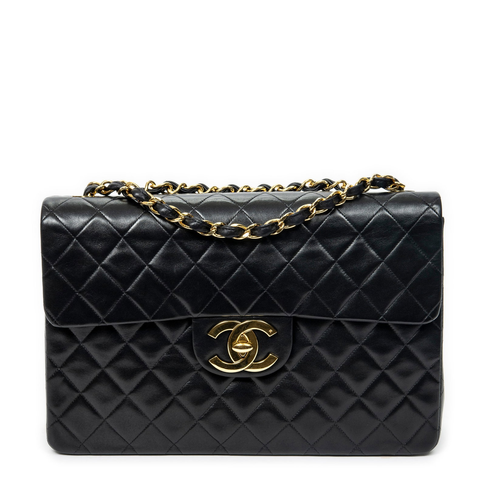 Chanel Maxi Jumbo XL Flap Shoulder Bag: Chanel Maxi Jumbo XL Flap shoulder bag in black quilted lambskin leather, gold hardware, marked 2726155 (1991-1994); third-party authenticated 13.5 in. x 9 in. x 4 in. Condition A; excellent