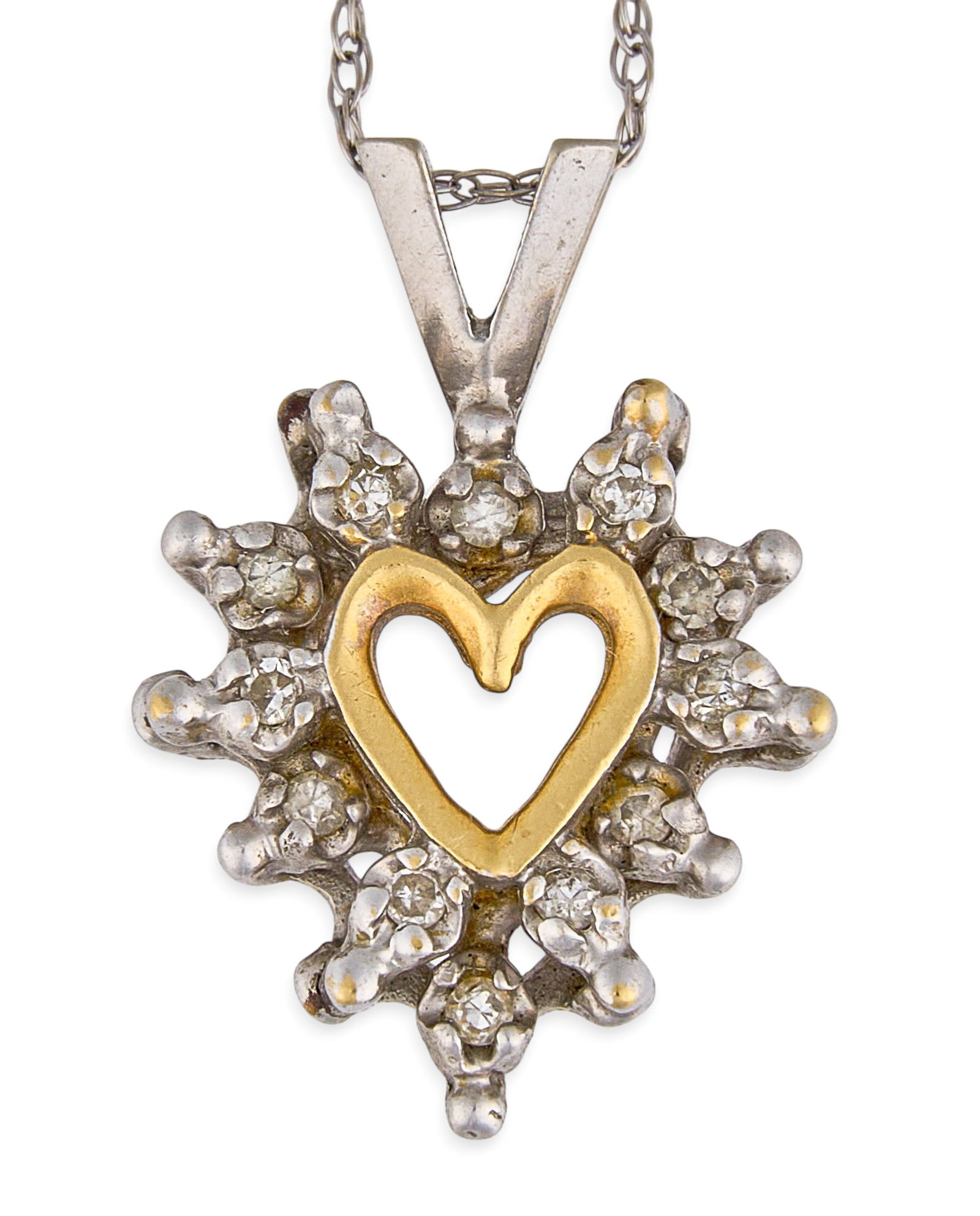 14K Diamond Heart Pendant Necklace: 14K heart pendant necklace set with halo of round-cut diamonds, in a two-tone setting, pendant and clasp marked "14K" Length: 18 in. Total weight: 2.2 g Provenance: Property from a home in