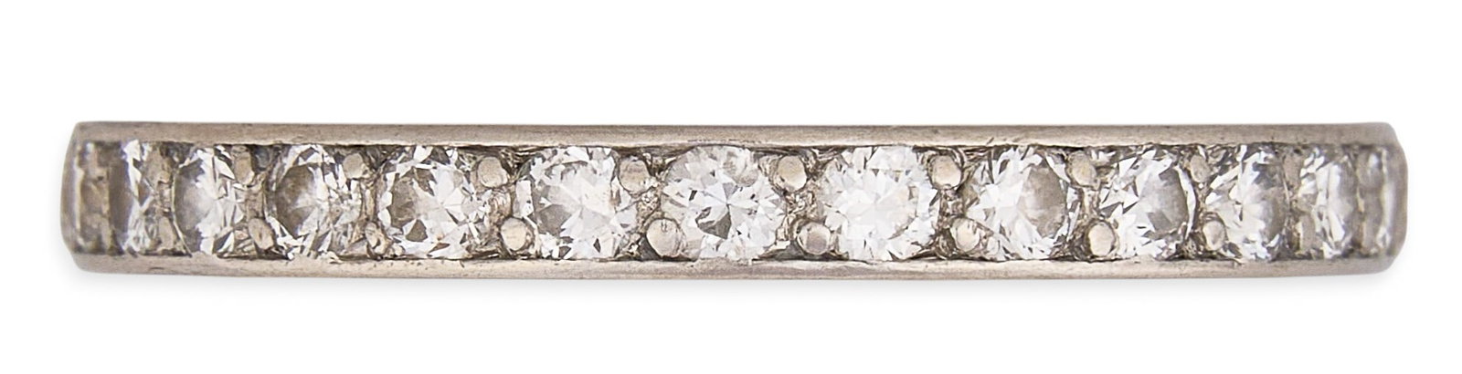 18K Eternity Diamond Ring: 18K white gold eternity ring, set with single row of round-cut diamonds Size: 7.5 Total weight: 2.74 g Provenance: Property from a home in the Alamo Heights neighborhood of San