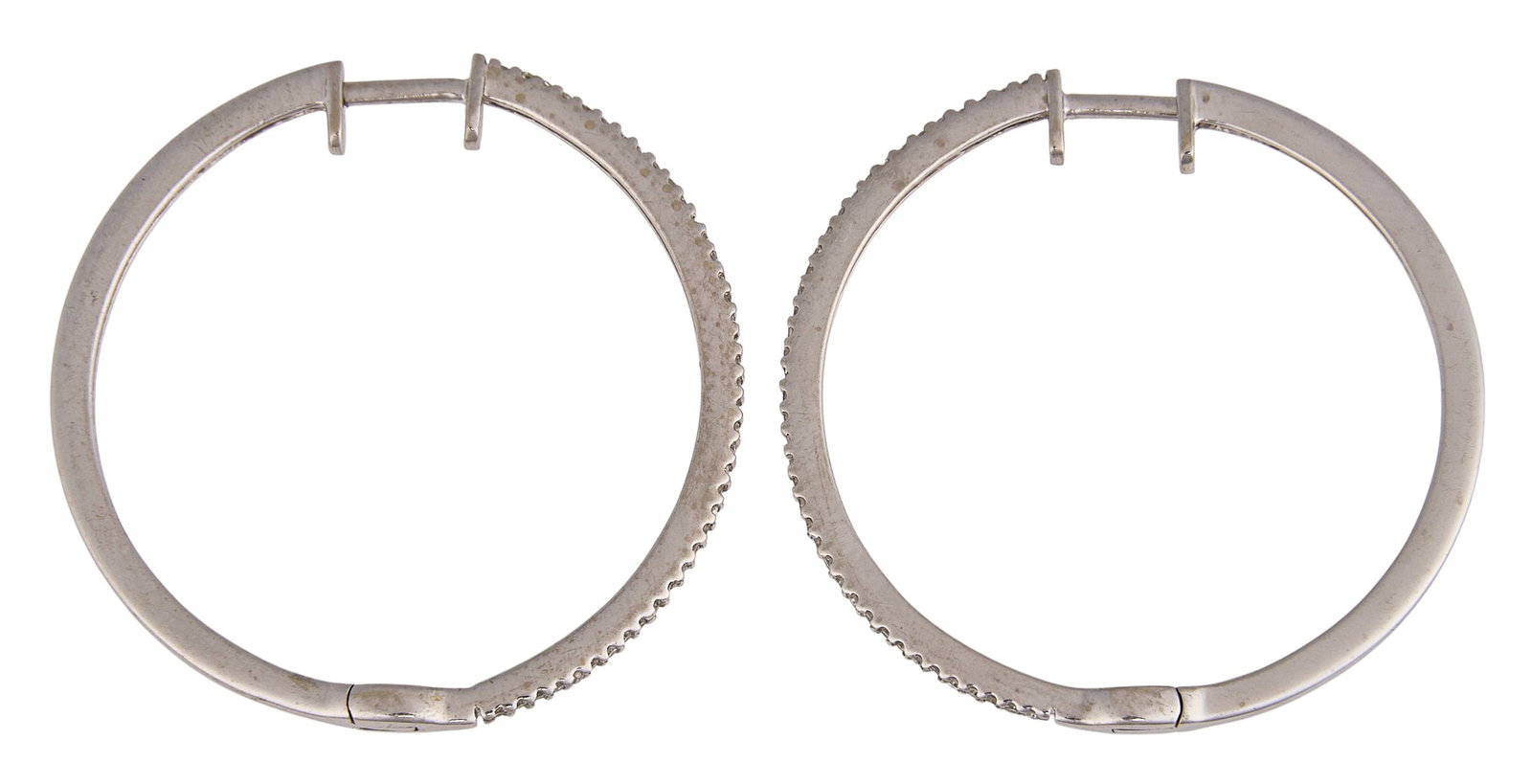 14K Diamond Hoops: Pair of 14K white gold hinged hoop earrings, set with round-cut diamonds, marked "14K" to posts Size: 1.25 in. / diameter Total weight: 4.7 g Provenance: Property from a home in San