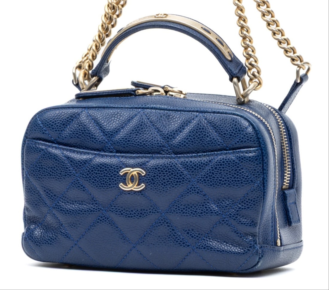 Chanel Bowling Top Handle Mini Handbag: Chanel Bowling Top Handle Mini handbag in blue caviar quilted leather, gold hardware, marked 2493311, includes sticker; third-party authenticated 7 in. x 4.5 in. x 3.25 in. Condition A; excellent