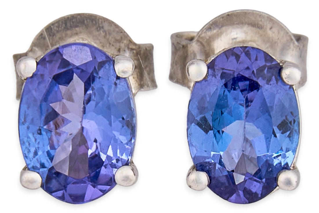 Sterling Silver Tanzanite Stud Earrings: Pair of sterling silver stud earrings, set with oval cut tanzanite, approximately 0.85 ct each, posts and backs marked "925" Total weight: 1.3 g Provenance: Property from a home in Kingsvill