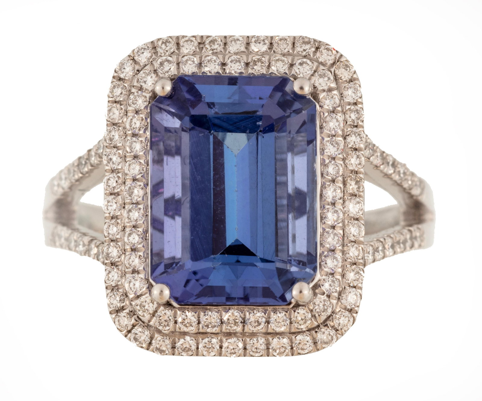 Platinum Tanzanite & Diamond Ring: Platinum ring centering an octagonal mixed-cut tanzanite, approximately 4.75 ct, accented by halo of 106 round brilliant-cut diamonds, approximately 0.52 ctw, accompanied by GGA report