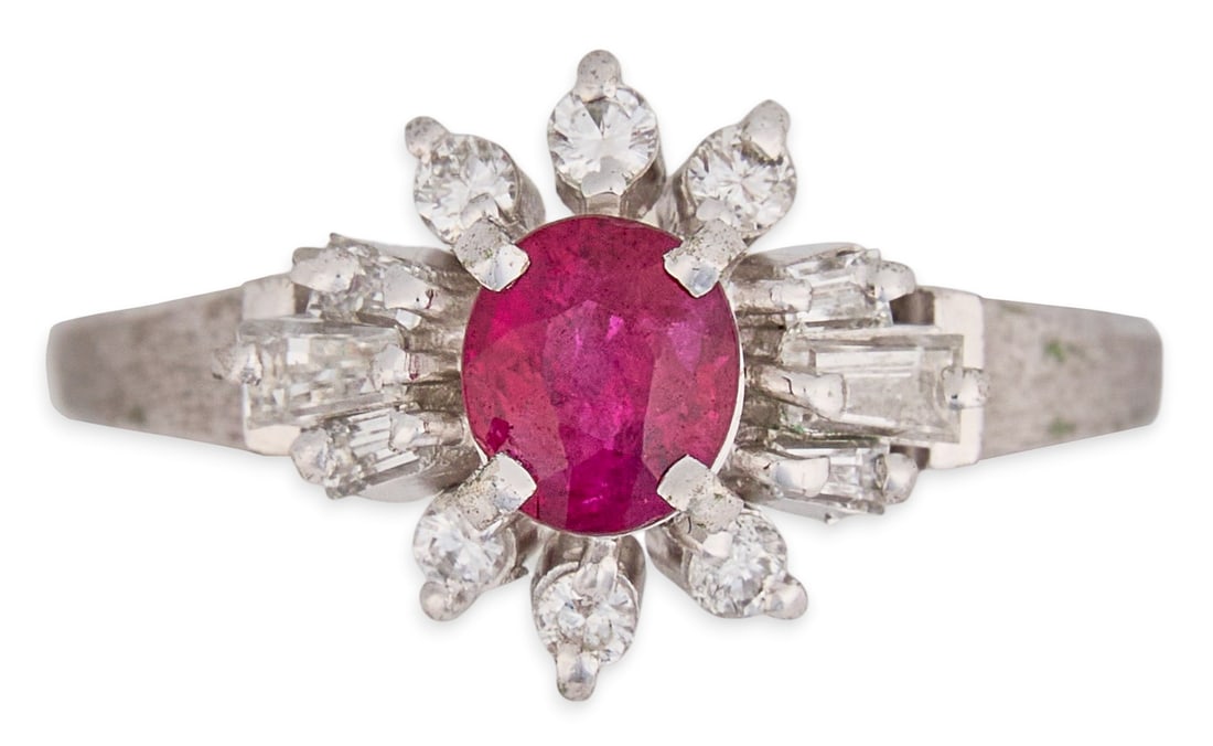 Platinum Ruby & Diamond Ring: Platinum ring set with oval cut ruby, approximately 0.56 ct, accented by round brilliant and baguette cut diamonds, approximately 0.39 ctw, VS2 clarity and G-H color, marked "Pt900" Siz