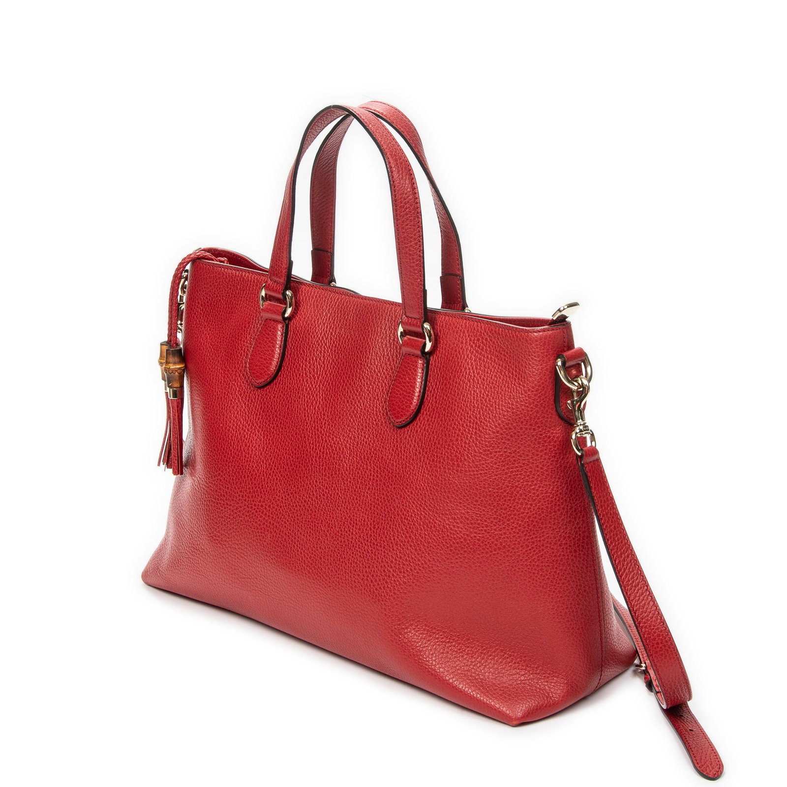 Gucci Bamboo Tassel Zip Tote Shoulder Bag: Gucci Bamboo Tassel Zip Tote shoulder bag in red grained calfskin leather, gold hardware, marked 449643 525040, includes strap; third-party authenticated 15.25 in. x 11 in. x 5.5 in. Condition A; exce