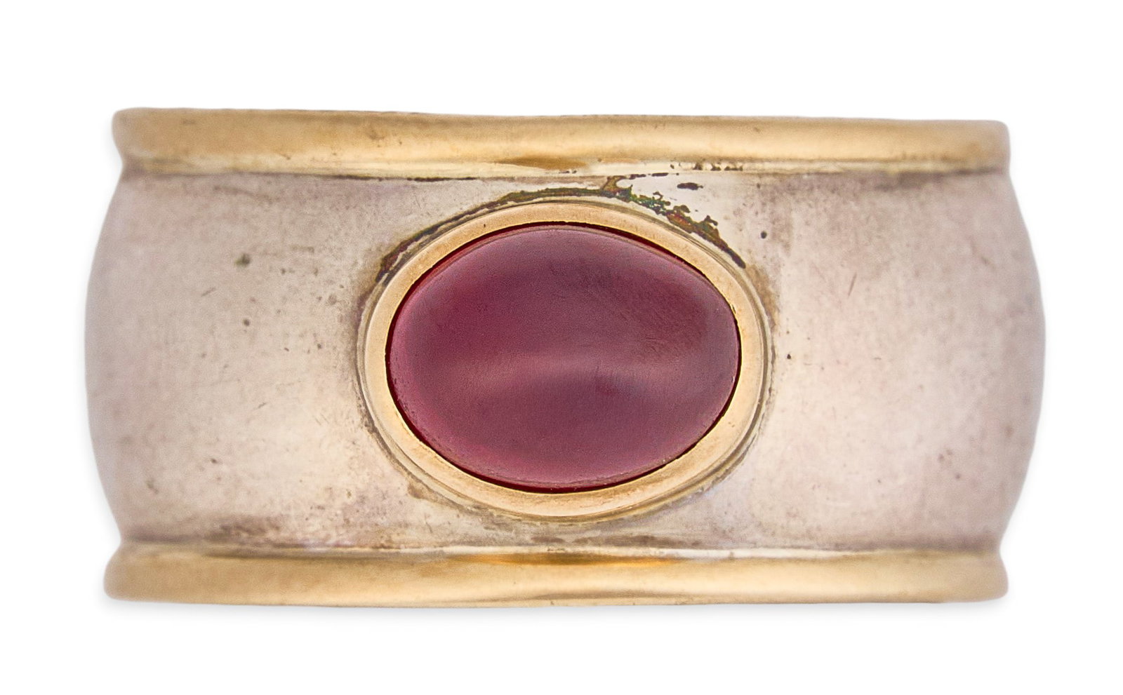 Sterling/14K Garnet Ring: Sterling silver and 14K gold ring, featuring single oval garnet cabochon in 14K bezel setting, marked "STERLING 14K" Size: 8 Total weight: 10.8 g Provenance: Property from a home in San