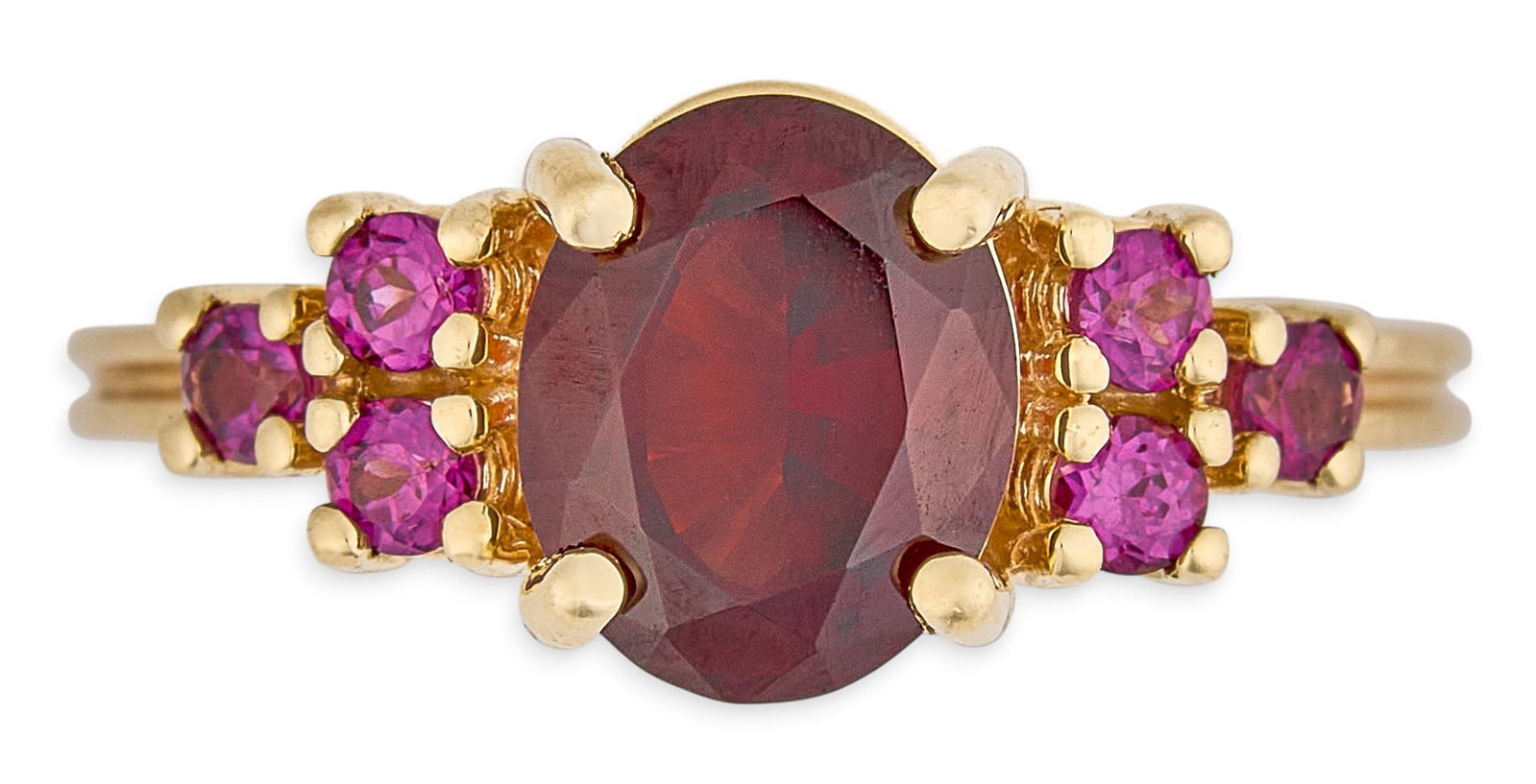 14K Garnet & Tourmaline Ring: 14K yellow gold (tested) ring set with oval cut garnet center stone, approximately 2.0 ct, flanked by six round brilliant cut pink tourmalines, approximately 0.3 ctw Size: 9.5 Total weight: