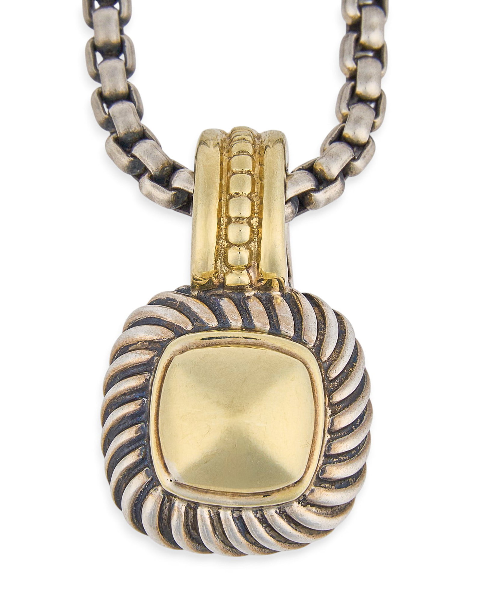 David Yurman Sterling/14K Pendant Necklace: David Yurman sterling silver and 14K gold pendant, on a sterling silver chain, marked D. YURMAN 925 585" Length: 16 in. Total weight: 18.78 g / 6.33 g pendant only Provenance: Property from
