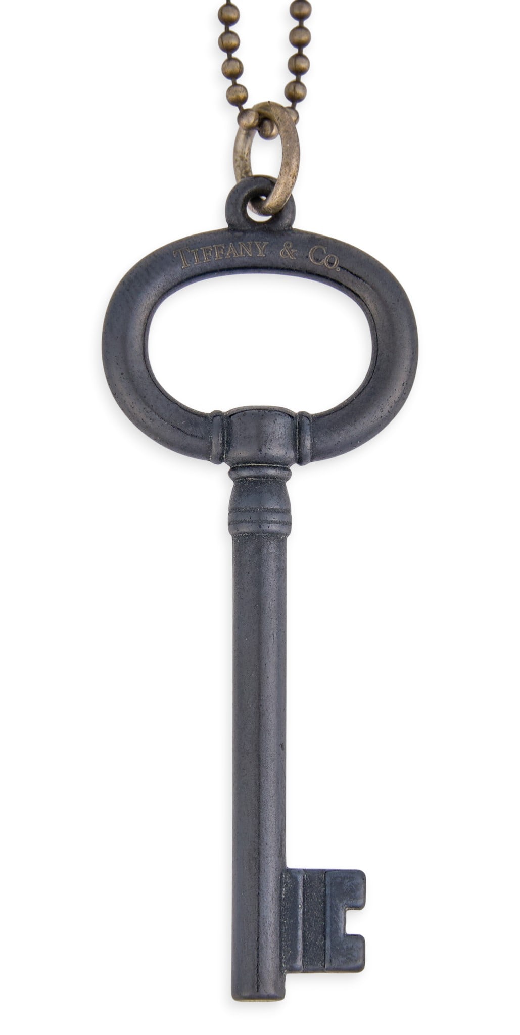 Tiffany & Co. Sterling Necklace with Titanium Key Pendant: Tiffany & Co. sterling silver necklace and titanium key motif pendant, each marked "Tiffany & Co.", chain marked "925" near clasp Length: 16 in. Total weight: 4.7 g
