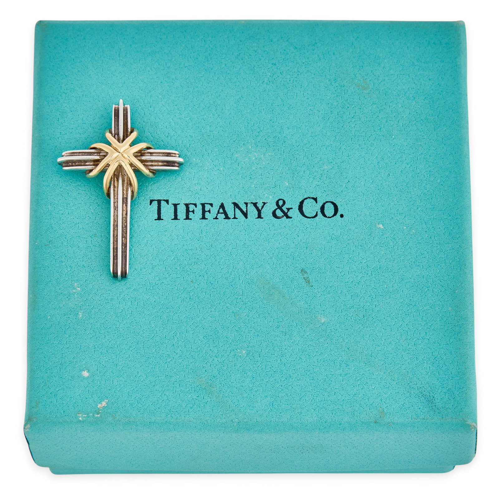Tiffany & Co. Sterling/18K Cross Pendant: Tiffany & Co. sterling silver cross pendant featuring applied 18K gold, marked "T & Co. 925 750" Size: 1.25 in. x 1 in. Total weight: 3.6 g Provenance: Property from a home in San