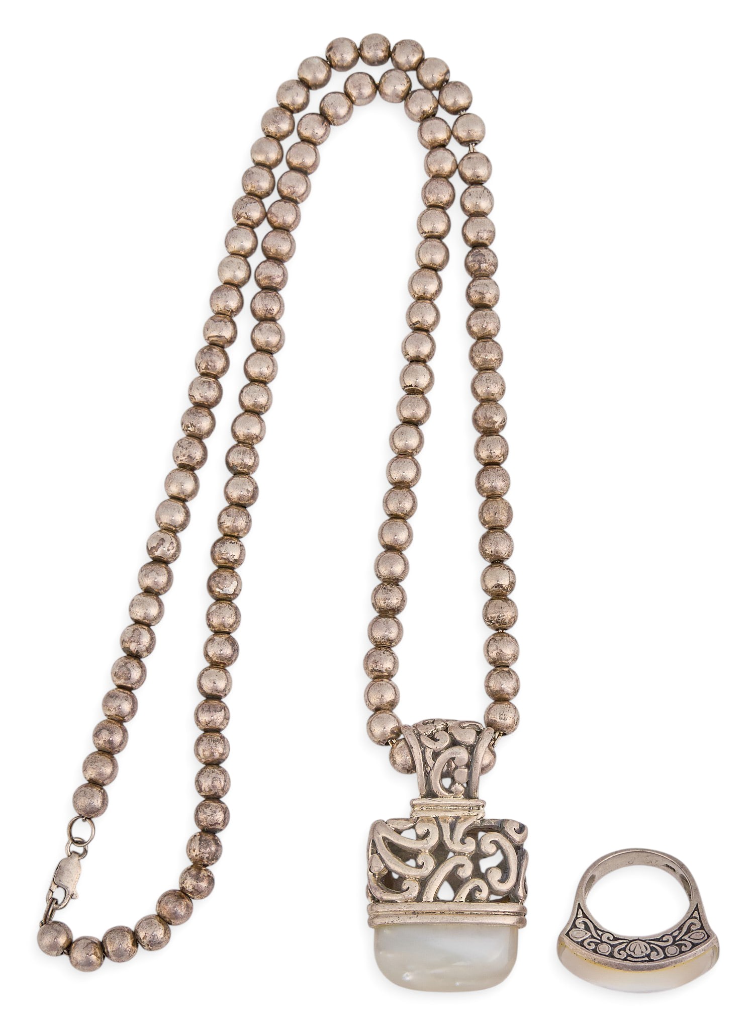 Sterling Silver & Mother of Pearl Set: Sterling silver necklace and ring set, each featuring scrollwork details and mother of pearl cabochons or inlay, pendant on single strand of sterling silver beads, marked "925" Length: 24
