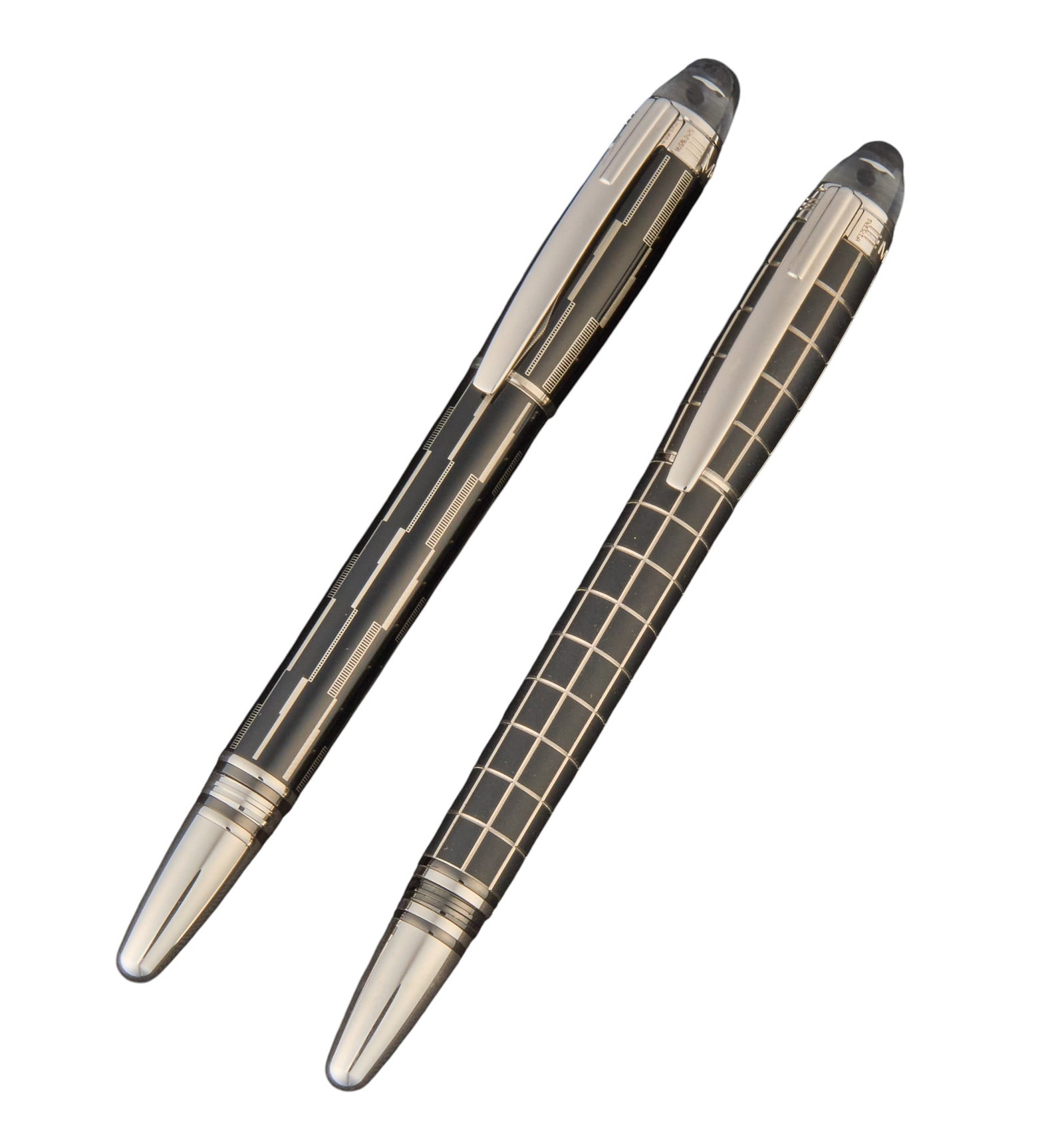 (2) Montblanc Starwalker Pens: Montblanc StarWalker writing pens, comprising a Metal/Rubber Grid ballpoint pen and a coordinating Metal/Rubber patterned fineliner/ rollerball, each with black rubberized and metal body, platinum-pla