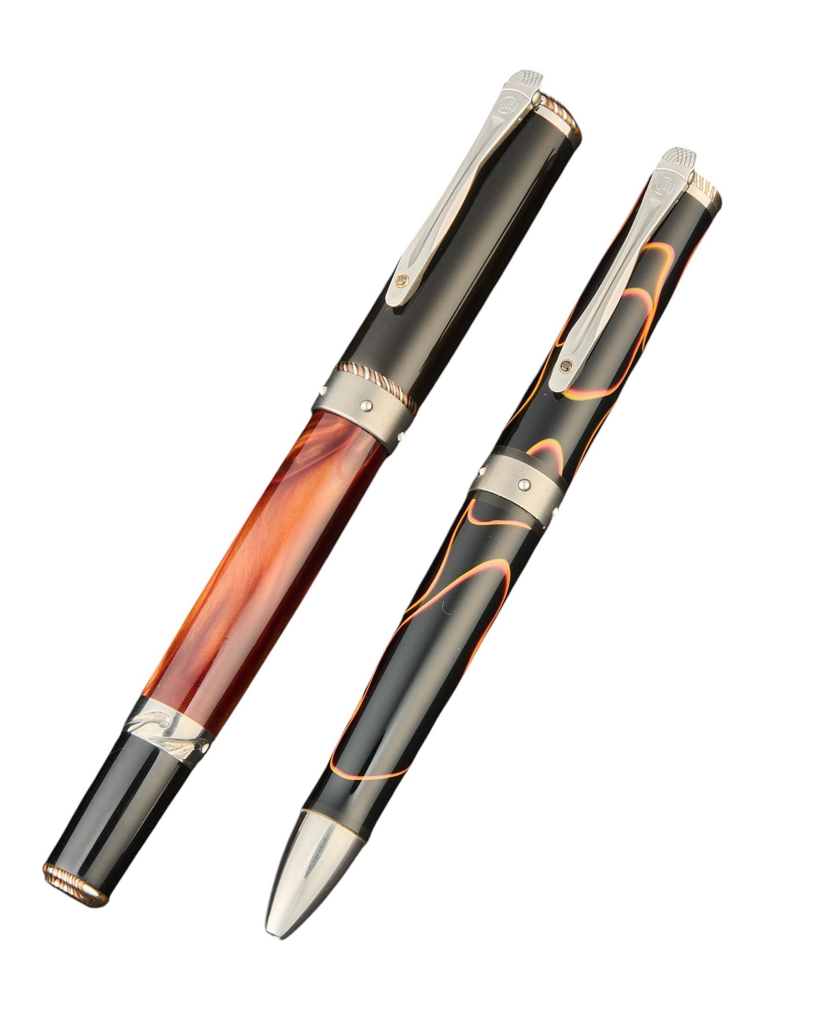 (2) William Henry Limited Edition Pens: Two William Henry limited edition pens, comprising a rollerball pen with black barrel decorated with red and orange wave-form inlay, and a second rollerball pen with black cap and brown pearlescent ba