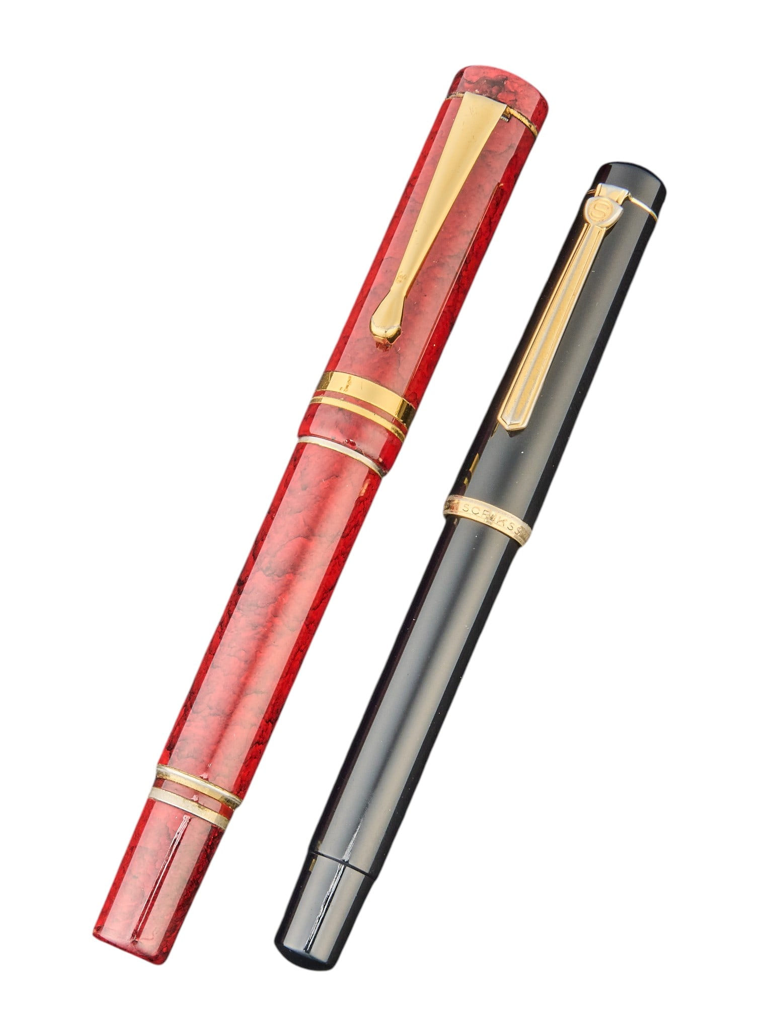 (2) Fountain Pens: One Skrikks black resin fountain pen, and one unmarked fountain pen marked "Germany, Iridium Point" on nib Provenance: Property from the New Braunfels, Texas home of award-winning set d