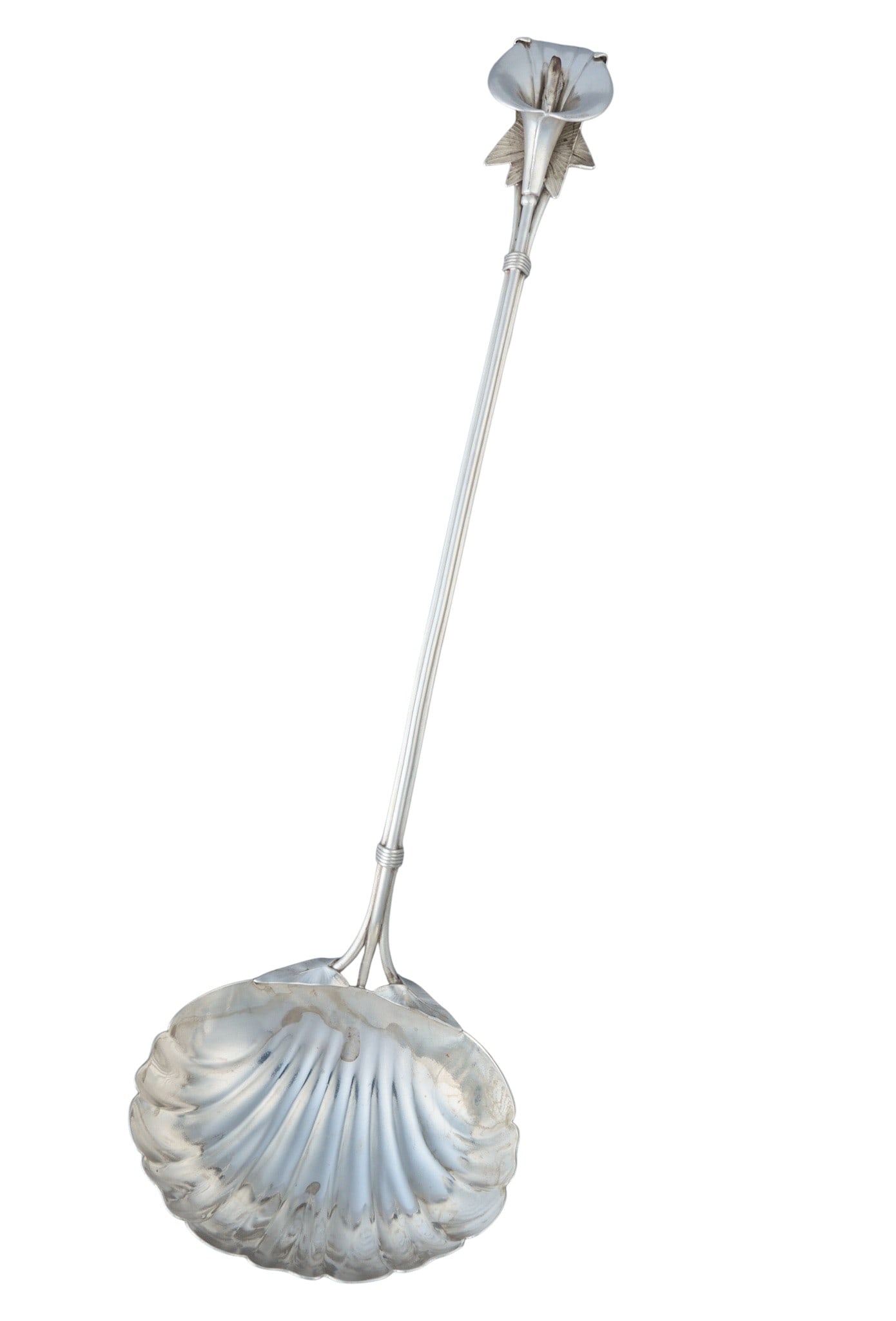 Floral Sterling Silver Ladle: Floral sterling silver ladle, with calla lily flower handle, monogrammed length: 13 in. Total weight: 4.90 ozt (weighable silver) Provenance: Property from the collection of an industrial