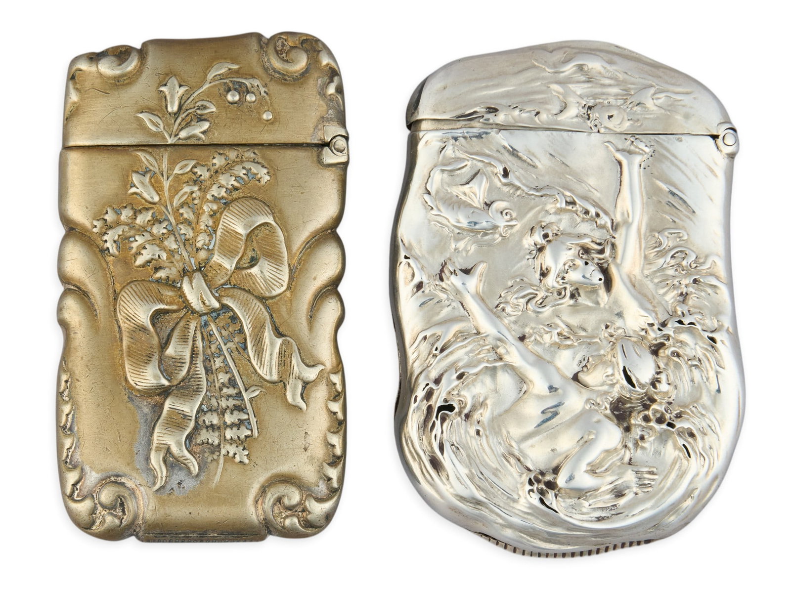(2) Sterling Silver Repousse Match Boxes: Two sterling silver repousse match boxes height 0.5 in. x width 2.5 in. x depth 1.5 in. Total weight: 2.26 ozt (weighable silver) Provenance: Property from the collection of an industrial chemicals