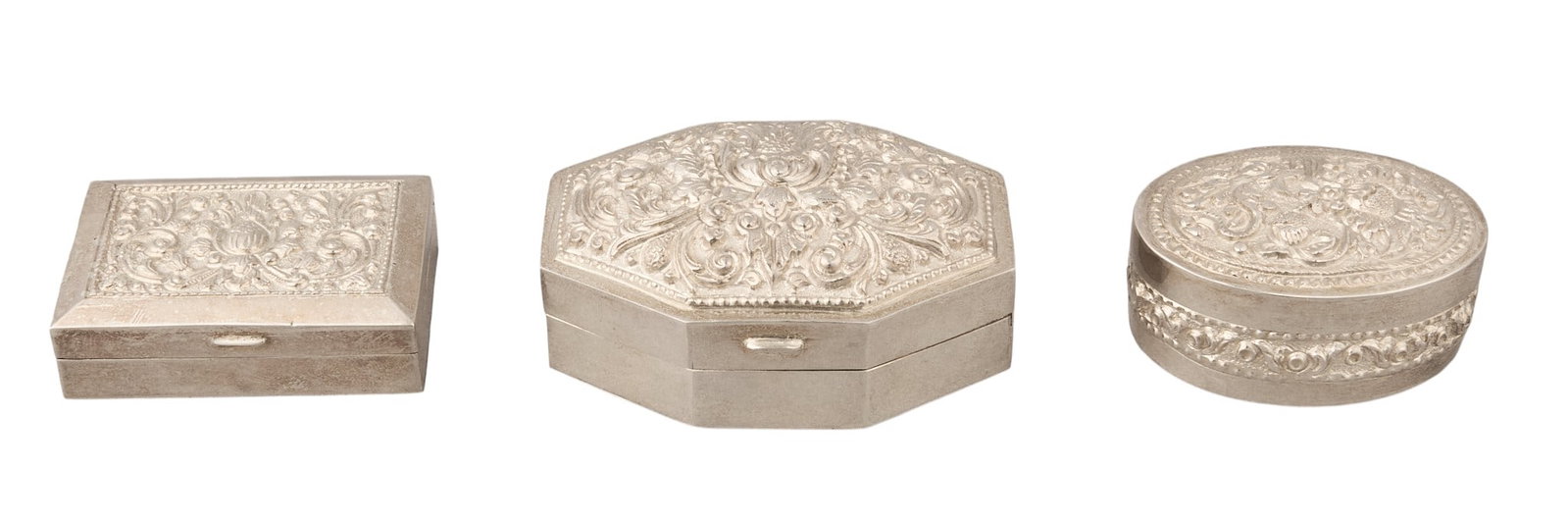 Collection of (3) Small Sterling Silver Repousse Boxes: Collection of three sterling silver repousse boxes height 1 in. x width 3 in. x depth 2.25 in. / largest Total weight: 4.83 ozt (weighable silver) Provenance: Property