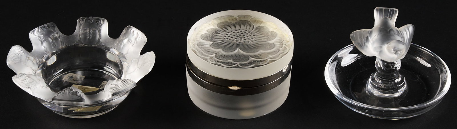 (3) Pc Lalique Boudoir Set: Three piece Lalique crystal boudoir set, includes dresser box, St. Nicholas tray, and swallow jewelry tray 3.5 in. x 4 in. x 4 in. / largest Provenance: Property from a home in San Antonio