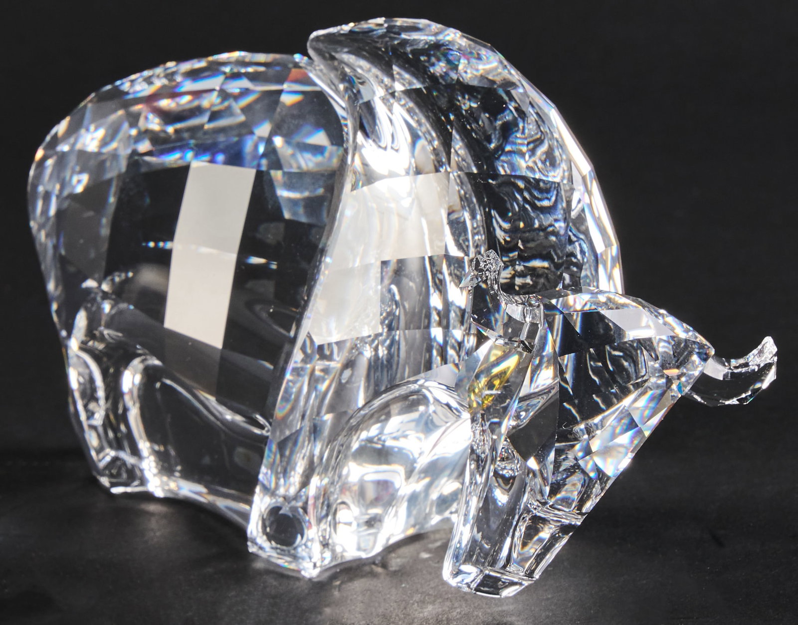 Swarovski Buffalo with Box: Swarovski crystal buffalo figurine, marked with Swarovski swan emblem on bottom, includes foam-lined storage box height 3.75 in. x length 6 in. x width 2.5 in. / figurine height 6.5 in. x width 10.75
