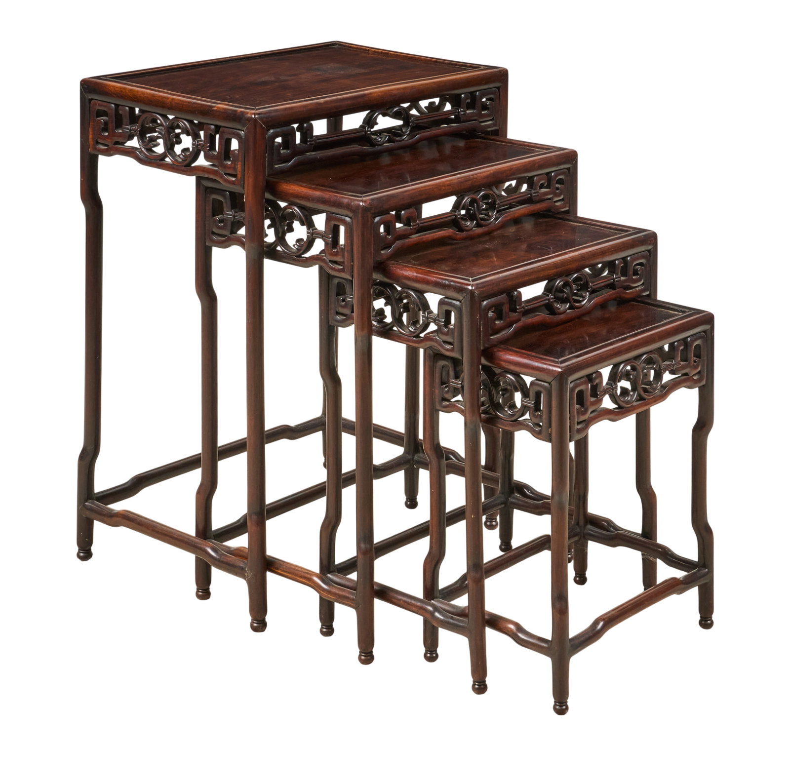 Set of (4) Nesting Tables: Set of four carved nesting tables, supported on stretcher legs, with bun feet height 28.5 in. x width 21.5 in. x depth 15 in. / largest Provenance: Property from a home in San Antonio,