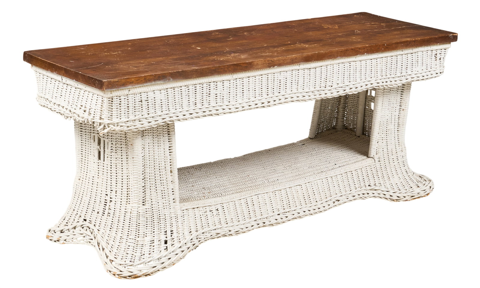 Wicker Casket Table: Vintage wicker casket stand with wood plank top, and lower open shelf height 25 in. x width 62.5 in. x depth 20 in. Provenance: Property from a home in San Antonio, Texas