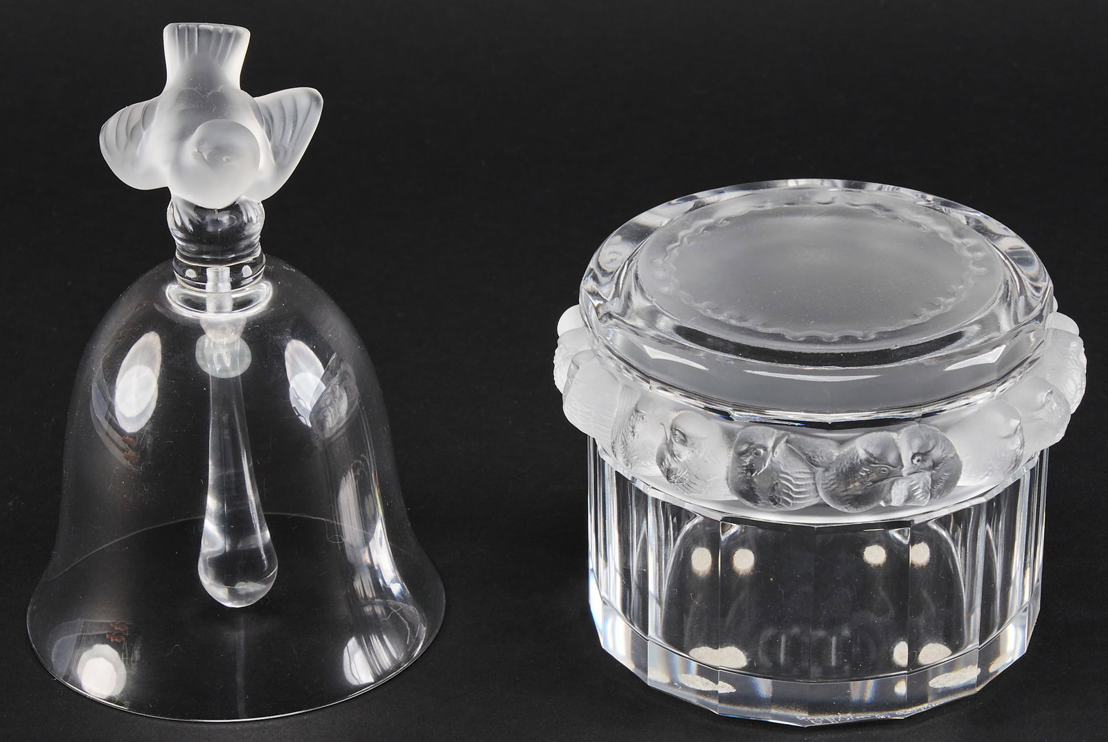 (2) Lalique Sparrow Dresser Box & Bell: One Lalique crystal table bell with sparrow finial, and one Lalique crystal Robinsons Mesanges Dresser Box with sparrow motifs, both signed height 5 in. x diameter 5 in. / largest Provenance: