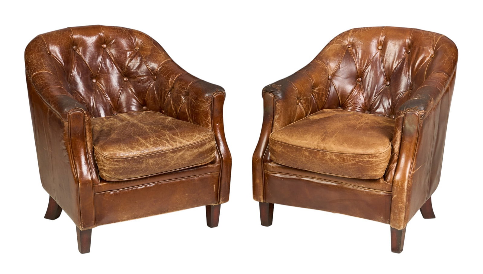 Pair of Tufted Club Chairs: Pair of distressed leather club chairs with tufting, and wooden legs height 31 in. x wicth 28 in. x depth 26 in. / each 