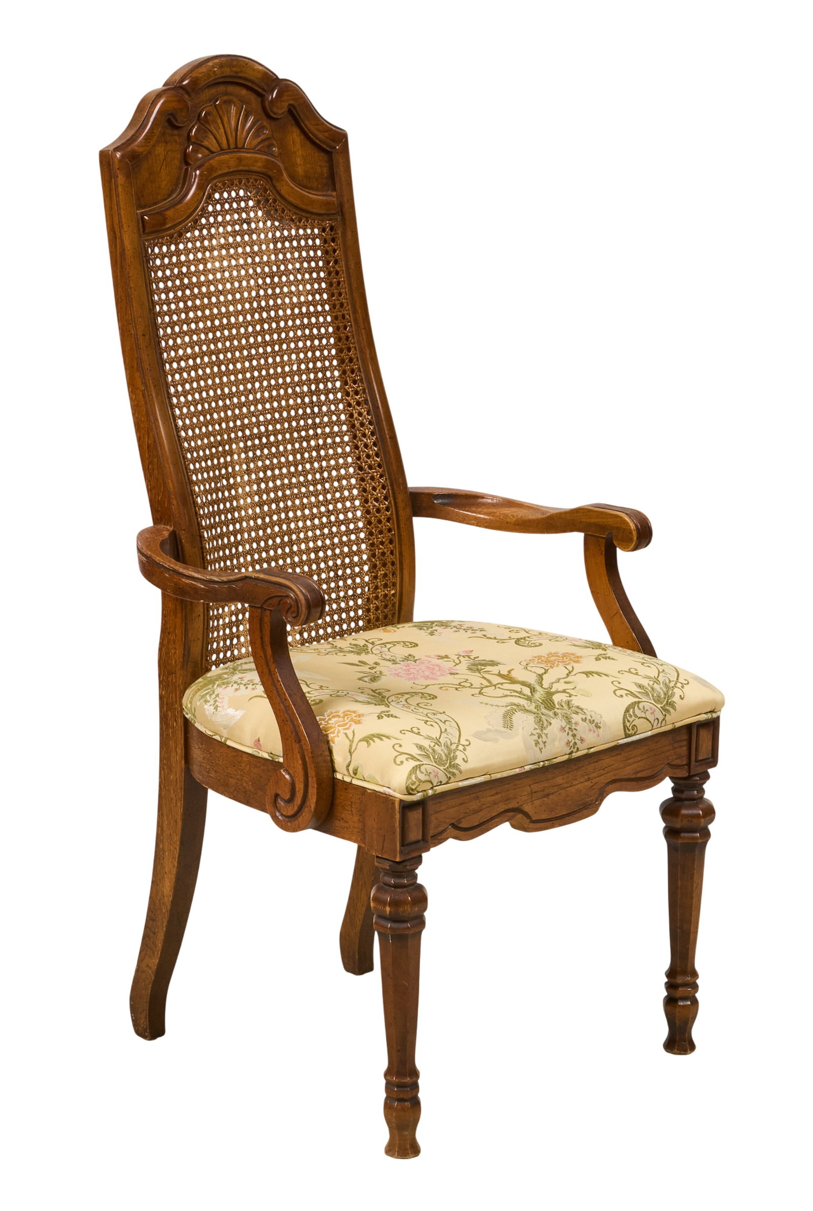 Cane Back Chair: Cane back chair with carved frame, and upholstered floral motif seat height 46 in. x width 22.5 in. x depth 23 in. Provenance: Property from a home in Boerne, Texas 