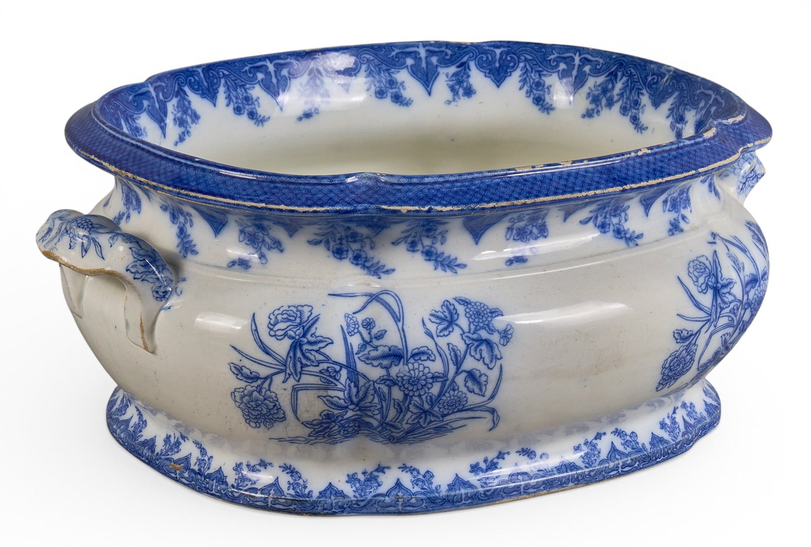 English Flow Blue and White Footbath: English flow blue and white footbath height 8 in. x width 19 in. x depth 15 in. Provenance: The estate of prominent Austin, Texas attorney George Cowden