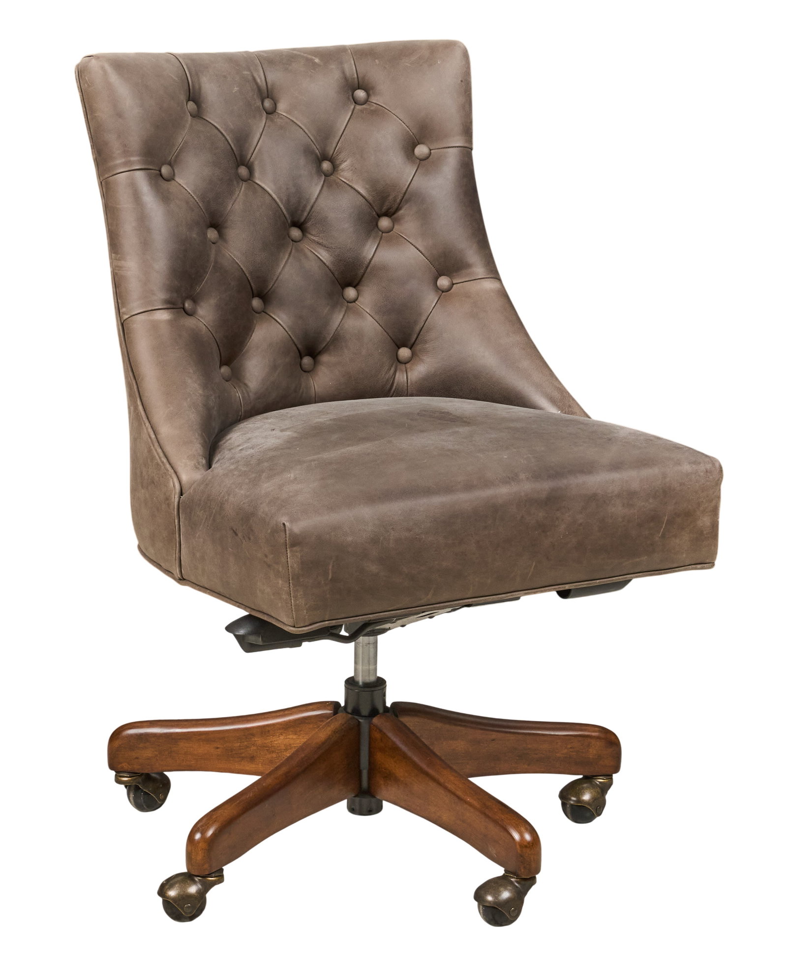 Tufted Leather Rolling Chair: Tifted leather executive's chair on rolling swivel base height 37 in. x width 26 in. x depth 22.5 in. Provenance: Property from a home in San Antonio, Texas