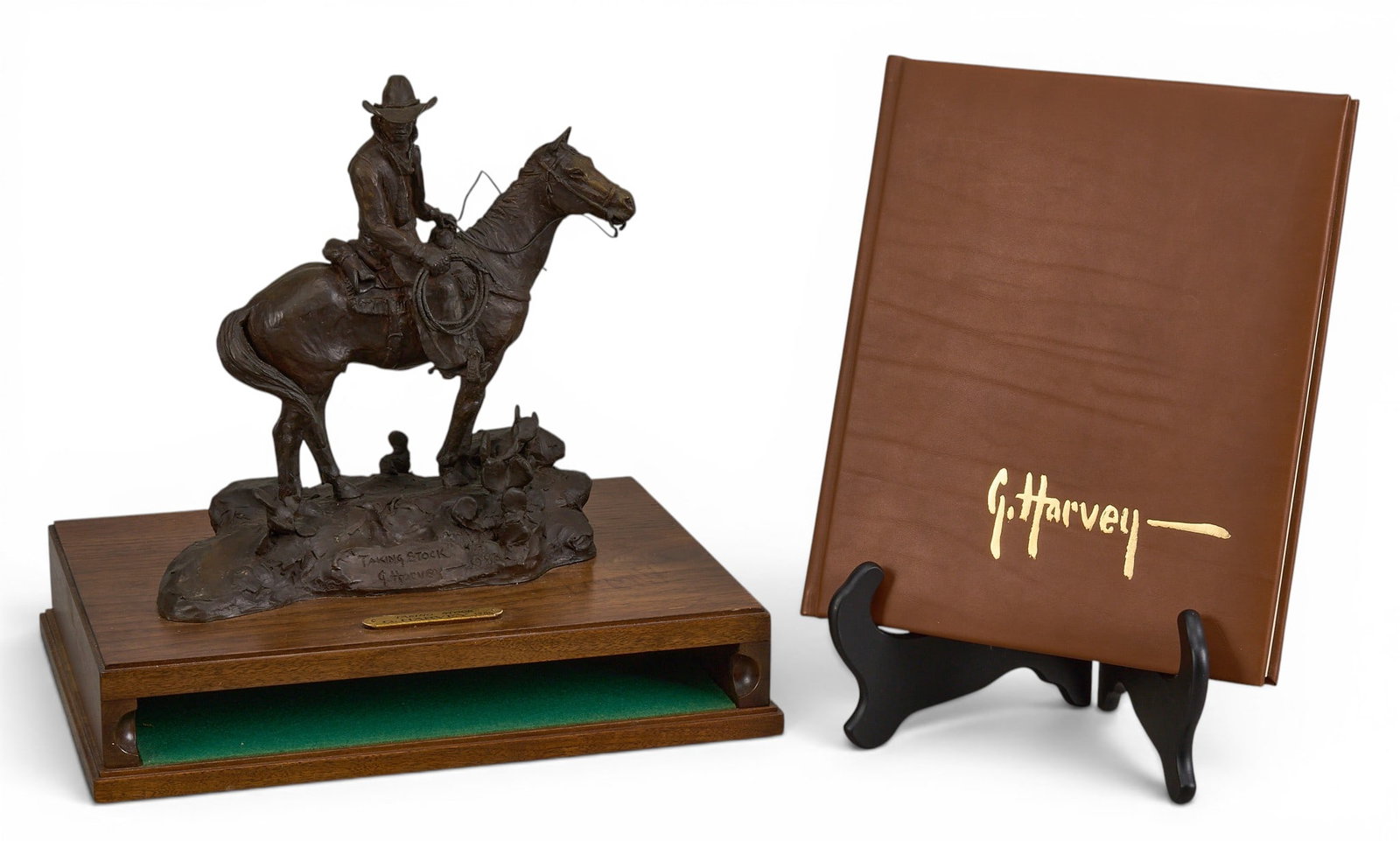 G. Harvey, "Taking Stock": G. Harvey (Gerald Harvey Jones, Texas, 1933-2017), "Taking Stock", artist-cast bronze sculpture on wooden holder display base, incised signature, edition number 2/100, and