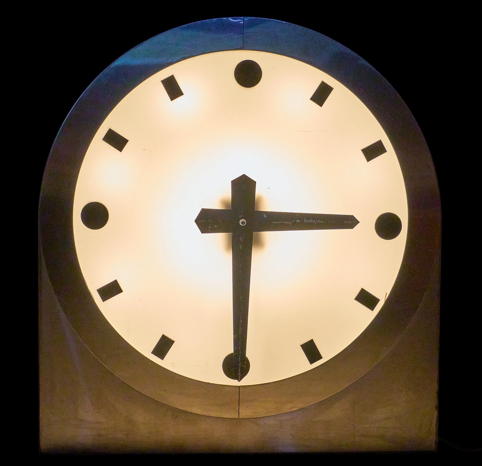 Large Machine-Age Master Style Lighted Clock: Large vintage machine-age master style clock with aluminum case, illuminated in the style of Rhode for Herman Miller, likely institutional, in working condition height 39 in. x width 36 in.