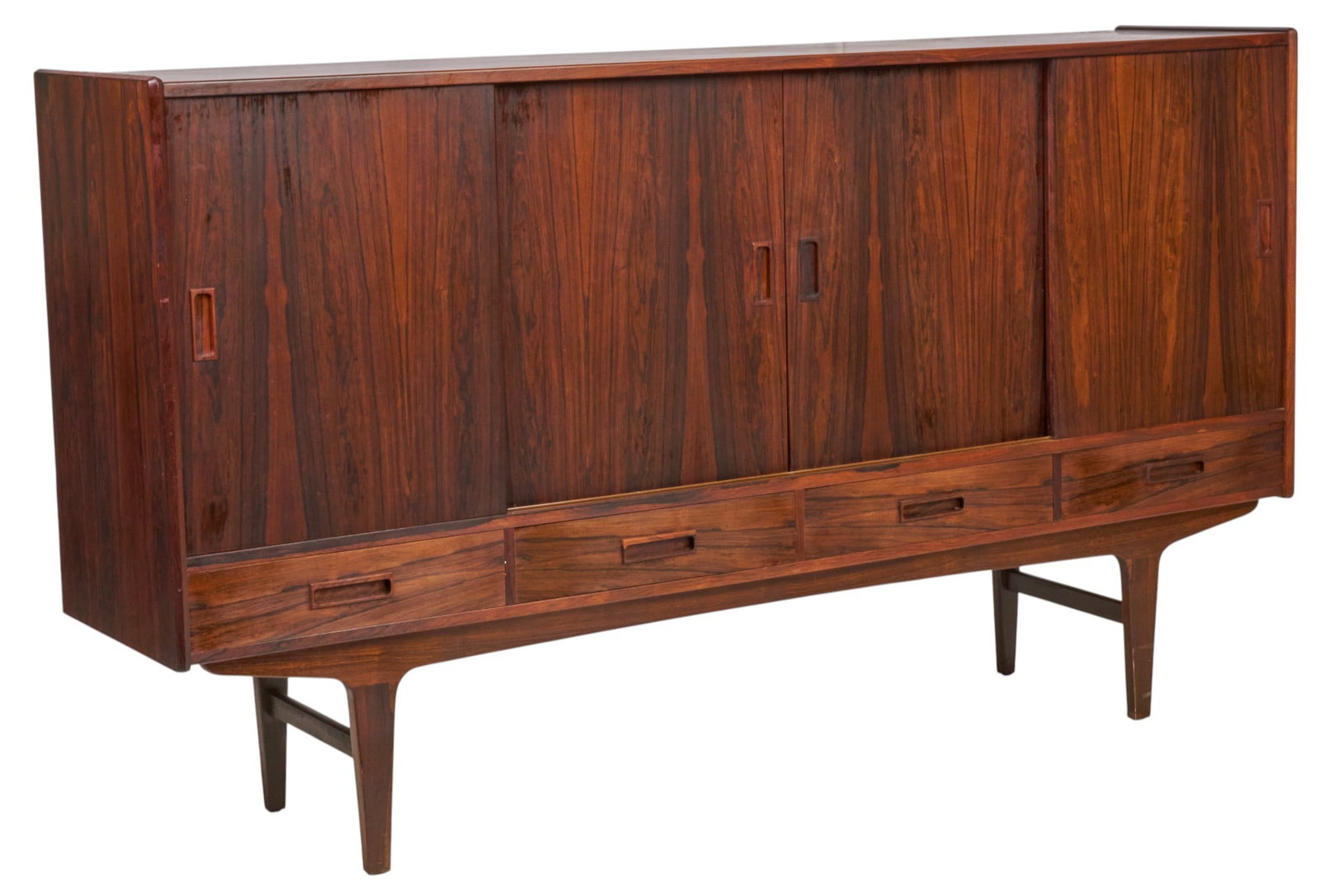 Danish Mid-Century Credenza: Danish mid-century credenza with four sliding cabinet doors opening to shelved interior, and four lower drawers, supported on tapered legs height 44.5 in. x width 79 in. x depth 17.5 in. 