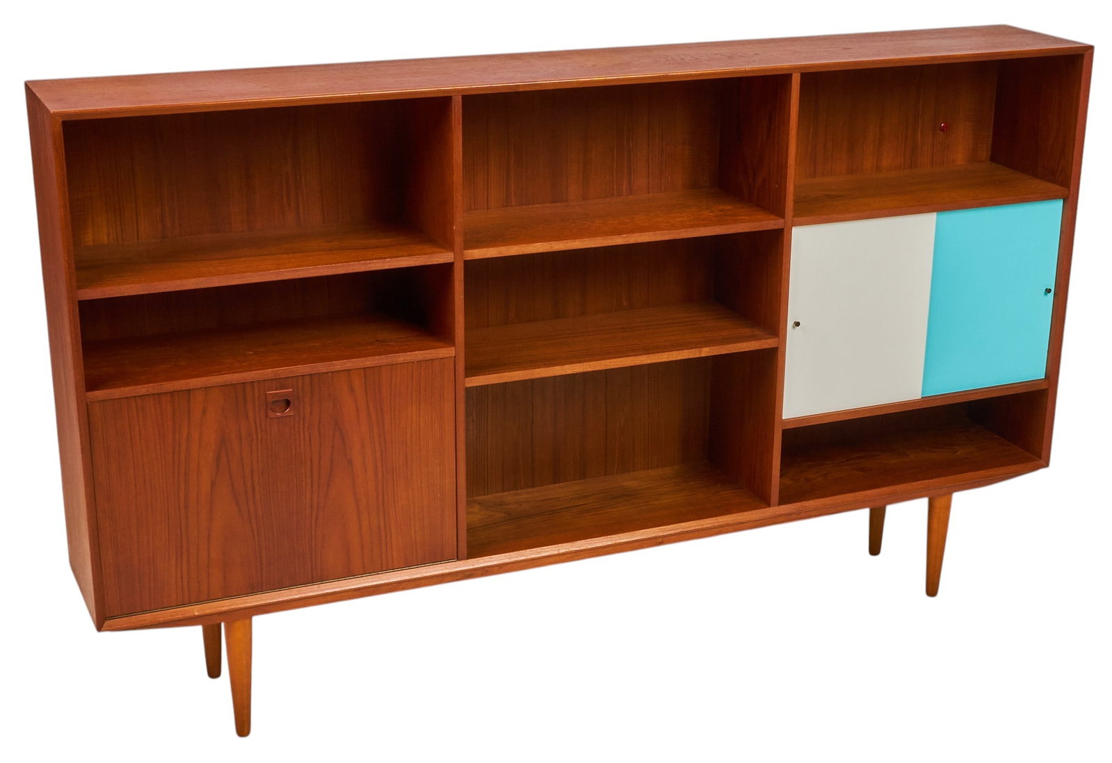 Danish Mid-Century Bookcase: Danish mid-century bookcase with one drop-front cabinet, and pair of sliding painted wood doors that reveal interior with small shelf, supported on pin legs height 46.5 in. x width 79 in. x depth