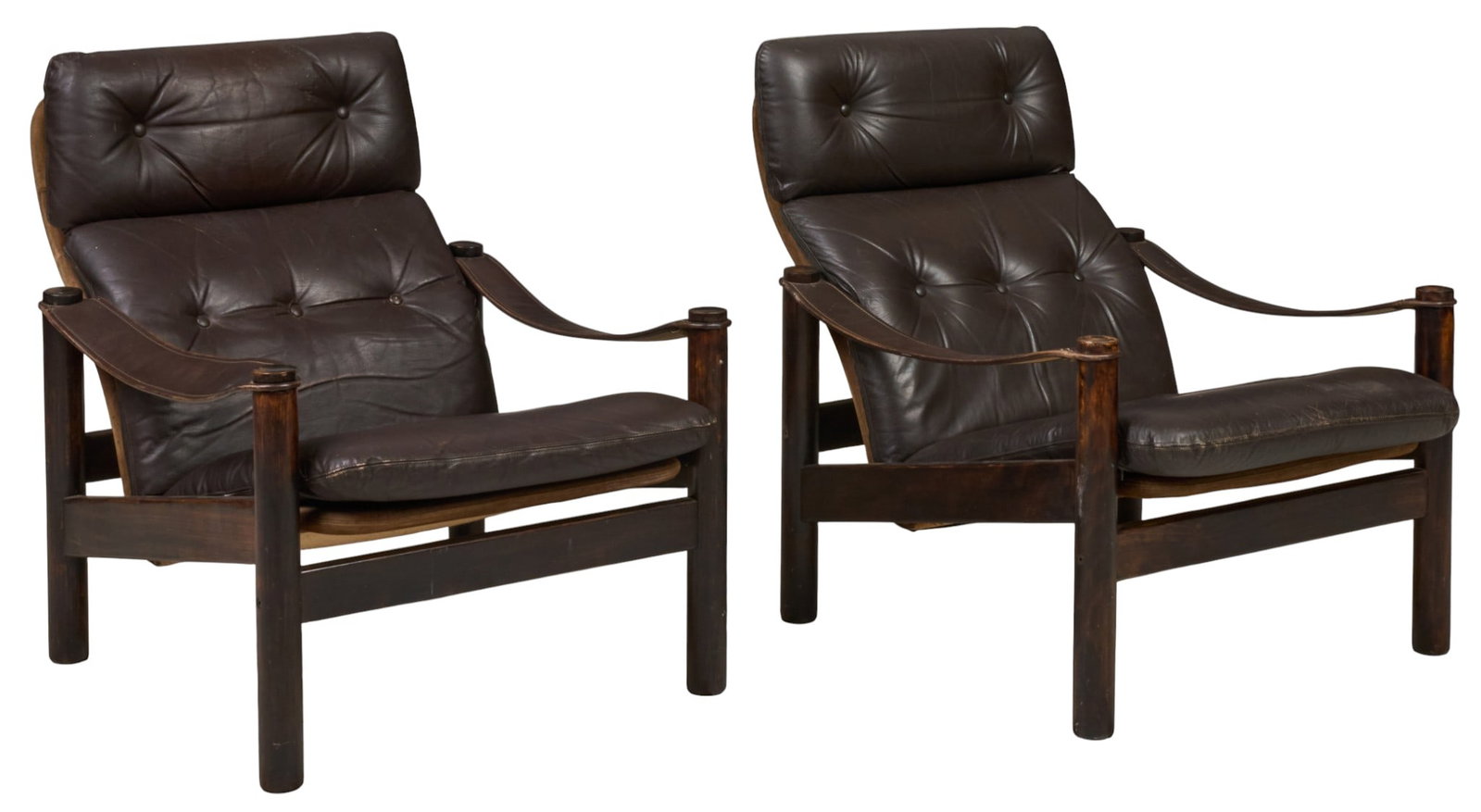 Pair of Danish Mid-Century Lounge Chairs: Pair of Danish mid-century lounge chairs featuring dark brown tufted leather upholstery and dark wood frame, raised on pin legs height 30 in. x width 29 in. x depth 34 in. / each