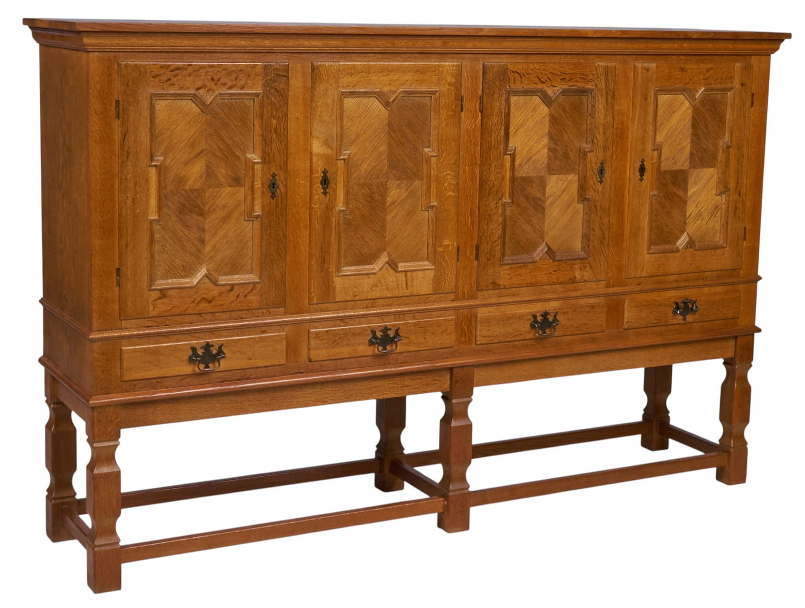 Henning Kjaernulf, Mid-Century Credenza: Henning Kjaernulf (Denmark) mid-century credenza with four carved cabinet doors opening to interiors with shelves, above four drawers, supported on high faceted block legs height 51.5 in. x width 79