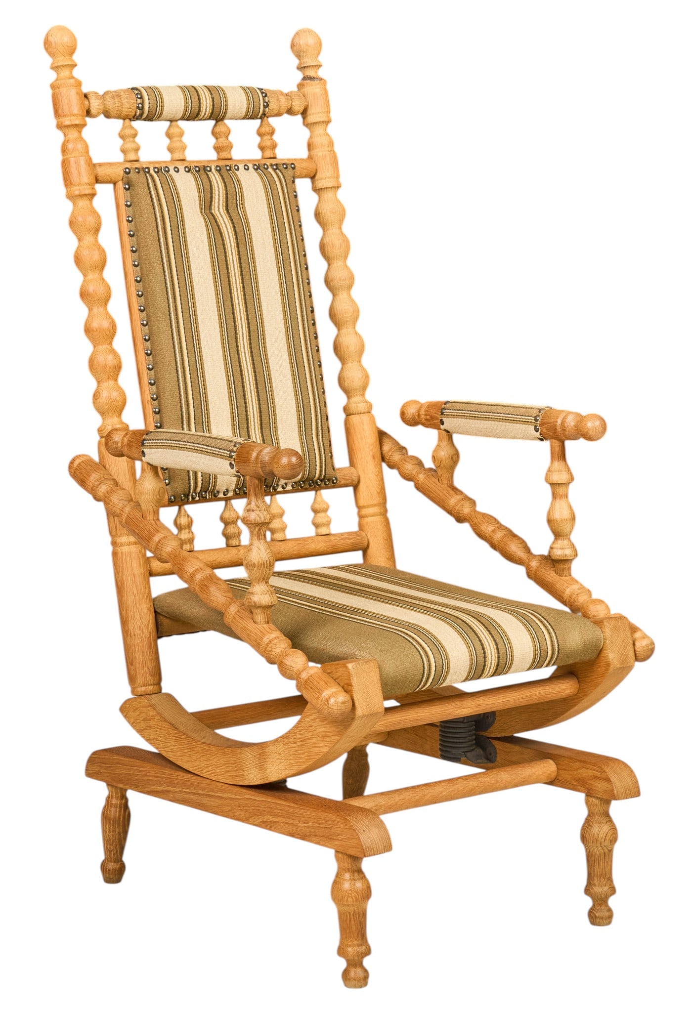 Danish Mid-Century Oak Platform Rocking Chair: Mid-century oak platform rocking chair, elaborately turned frame with tall upholstered back, padded armrests and seat in striped fabric, brass nailhead trim, spring-mounted rocking mechanism height