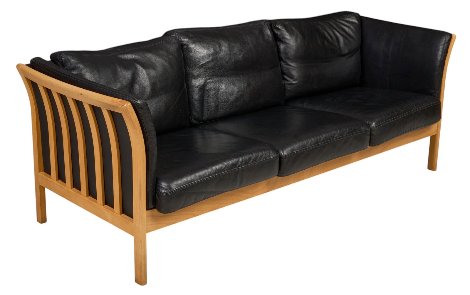 Danish Mid-Century Black Leather Sofa: Danish mid-century three-seat sofa, black leather upholstery with loose seat and back cushions, light wood frame with curved slatted sides, raised on square legs height 28 in. x width 79.5 in. x