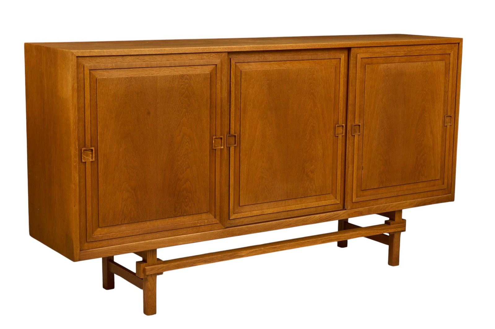 Danish Mid-Century Credenza: Danish mid-century credenza with three sliding doors to interior with felt lined trays and shelving, supported on block legs height 42 in. x width 78.5 in. x depth 18 in. 