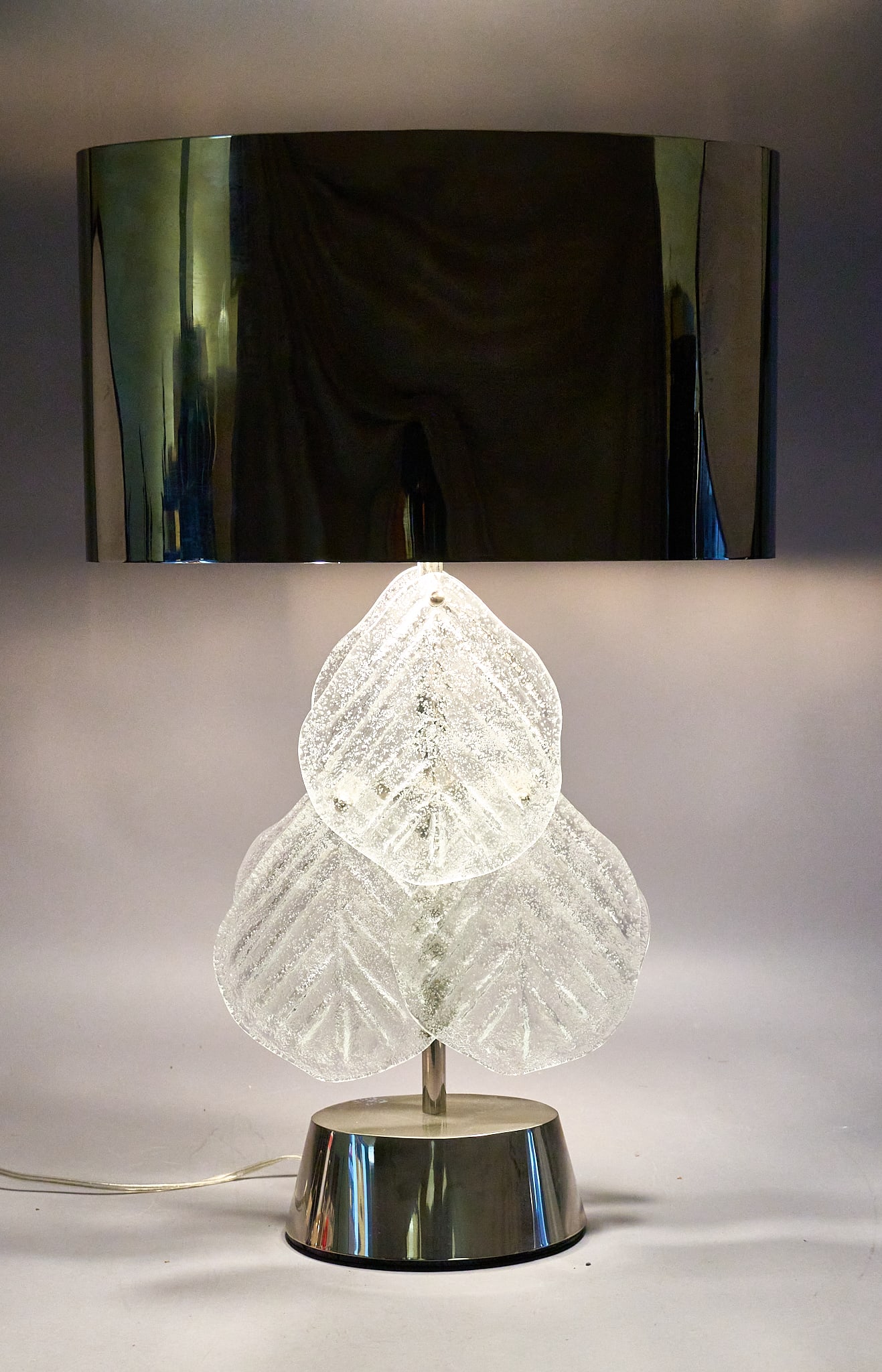 Vintage Italian Glass and Stainless Steel Lamp: Vintage Italian table lamp featuring a cluster of frosted glass leaves, on a stainless steel frame and base, includes a reflective shade height 32.5 in. x width 20 in. x depth 12 in. Provenance: Prope