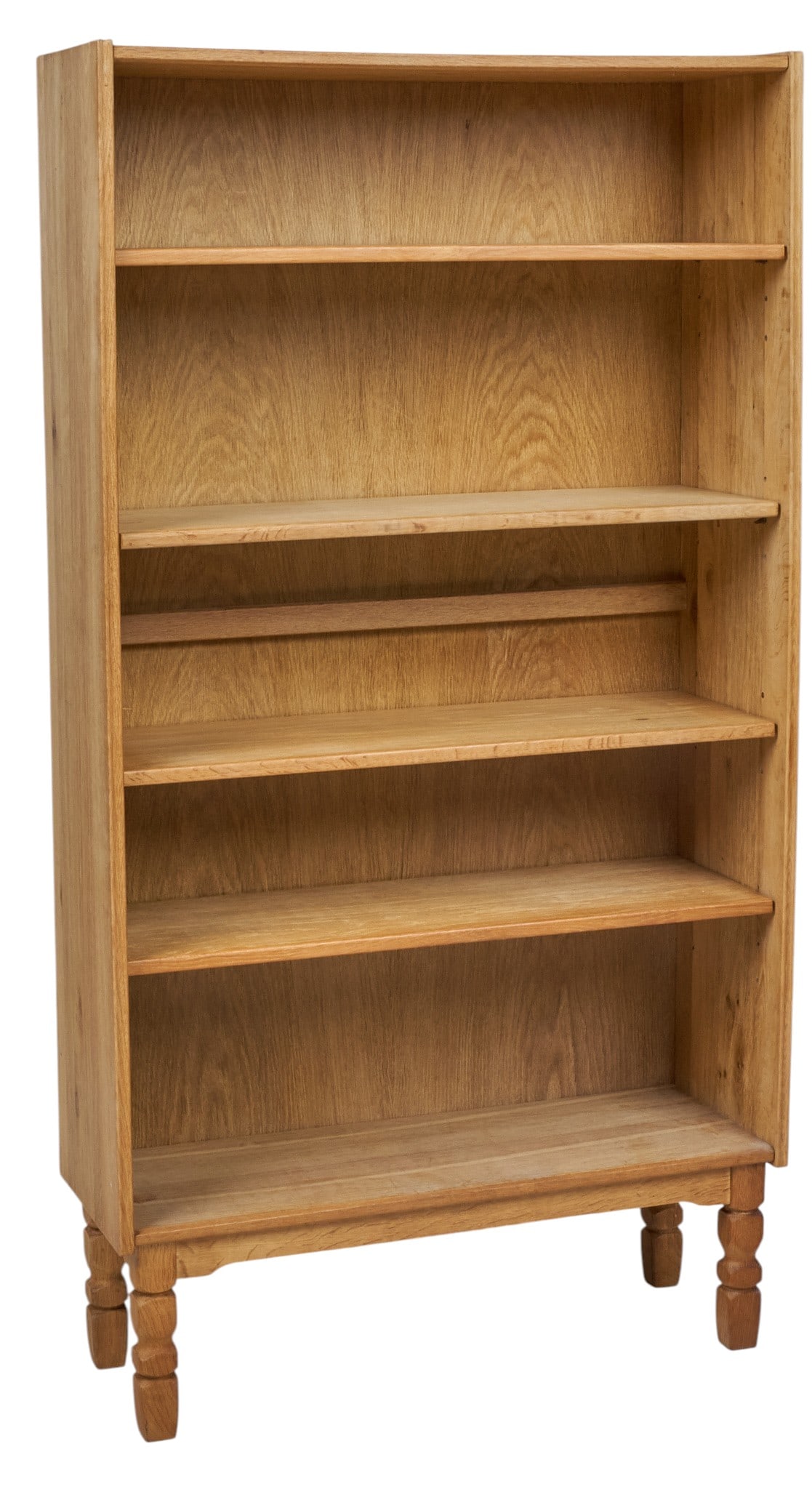 Henning Kjaernulf, Mid-Century Bookcase: Henning Kjaernulf (Denmark) oak mid-century bookcase with four adjustable shelves, supported on faceted block legs height 67 in. x width 35.5 in. x depth 13 in.